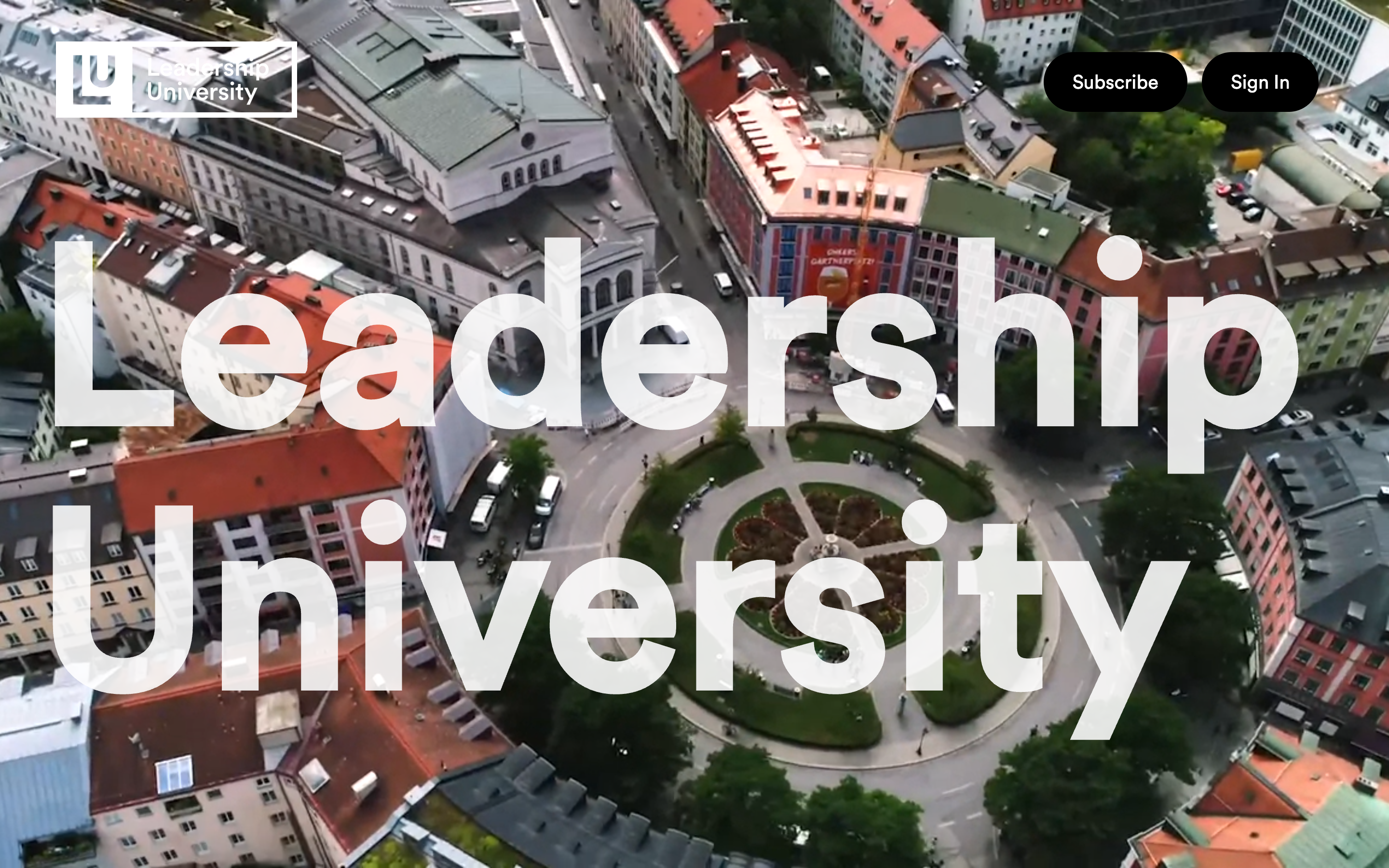 Leadership University home — the wordmark set over an aerial city view.